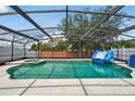 A sparkling screened-in pool and spa offer a relaxing outdoor experience at 1224 Blackwater Pond Dr, Orlando, FL 32828