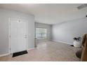 Bright foyer with tiled flooring leading into a spacious living area, adjacent to a window-lit room at 1292 Cavender Creek Rd, Minneola, FL 34715