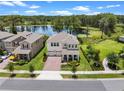 Beautiful two-story home with a well-manicured lawn and a scenic lake view at 17996 Adrift Rd, Winter Garden, FL 34787