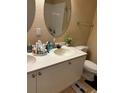 Bathroom featuring dual sinks, white cabinetry, and neutral wall paint at 2536 Lancien Ct # 5, Orlando, FL 32826