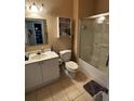 Compact bathroom design showcasing tiled floors, a shower, and ample storage at 2536 Lancien Ct # 5, Orlando, FL 32826