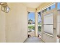 View from the front entry area, showing the front yard through a screen door at 2742 Woodruff Dr, Orlando, FL 32837