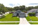 Inviting single-story home boasts a neatly kept lawn, a two-car garage, and lovely curb appeal at 3101 Linton Rd, Kissimmee, FL 34758