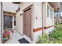 Inviting front door is accented by vibrant landscaping and a charming exterior at 3118 S Semoran Blvd # 2, Orlando, FL 32822