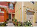 Charming home featuring colorful exteriors, an inviting entrance, and well maintained landscaping at 509 Cresting Oak Cir # 73, Orlando, FL 32824