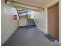 Cozy condo entryway featuring stairs, door, and a 'Welcome' doormat at 614 Orange Dr # 196, Altamonte Springs, FL 32701