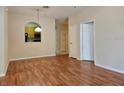 Inviting living room featuring hardwood floors, a view of the kitchen, and neutral wall colors at 6214 Stevenson Dr # 208, Orlando, FL 32835