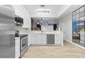 Updated kitchen featuring a stylish mirror and stainless steel appliances at 6388 Castelven Dr # 102, Orlando, FL 32835