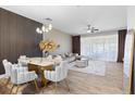 Open-concept dining and living area with luxury decor and abundant natural light at 6388 Castelven Dr # 102, Orlando, FL 32835