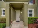 Close up of the front door, showcasing the entryway and landscaping at 7462 Bentonshire Ave, Windermere, FL 34786