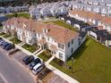 Bird's-eye view of townhomes with private pools and modern architecture in a well-planned community at 8934 Stinger Dr, Davenport, FL 33896