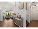 Inviting entryway with elegant decor, a staircase leading to the upper level, and a glimpse into the spacious living area at 922 Grazie Loop, Davenport, FL 33837