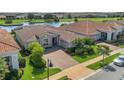 Stunning aerial view of home with golf course and pond at 13232 Alderley Dr, Orlando, FL 32832