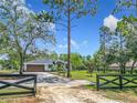 Beautiful home on a spacious lot with mature trees, long driveway and lush landscaping at 13735 Sw 73Rd St, Ocala, FL 34481