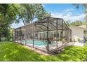 A private screened-in pool area, perfect for outdoor entertaining and relaxation, set in a well-maintained backyard at 205 Stevenage Dr, Longwood, FL 32779