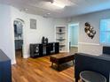 Inviting living room with hardwood floors, arched doorways, and stylish decor at 2515 Marlboro St, Orlando, FL 32806