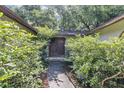 Landscaped walkway leading to the double front doors with a covered entrance way at 380 Violet Dell Dr, Casselberry, FL 32707
