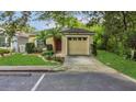 Charming one-story home with lush lawn, palm tree, and attached single-car garage at 4018 August Ct, Casselberry, FL 32707