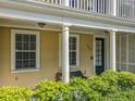 Charming front porch with cozy seating area and classic architectural details at 4584 Virginia Dr, Orlando, FL 32814