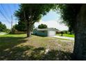 Well-kept home with a large yard and attached garage at 5472 E Grant St, Orlando, FL 32812
