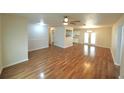 Spacious living room featuring beautiful hardwood floors and an open layout at 5472 E Grant St, Orlando, FL 32812