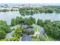 Aerial view showing the home's location on the water with a scenic view of the city skyline at 640 S Lake Formosa Dr, Orlando, FL 32803