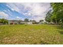 Expansive backyard with lush green grass, offering ample space for outdoor activities at 6401 Fortune Ln, Apopka, FL 32712