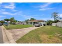 A charming one-story home, featuring an attached one-car garage and spacious front yard at 6401 Fortune Ln, Apopka, FL 32712