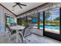 Enclosed patio with views of the pool, comfortable seating, and stylish decor at 1879 Odham Dr, Deltona, FL 32738
