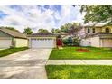 Charming single-story home with a well-kept lawn, showcasing its appealing curb appeal at 2031 Wekiva Reserve Blvd, Apopka, FL 32703