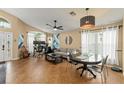 Open-concept living and dining area featuring tile flooring, modern lighting, and comfortable seating at 462 Lakepark Trl, Oviedo, FL 32765