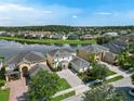 Beautiful community with a lake and luxurious homes at 5819 Covington Cove Way, Orlando, FL 32829
