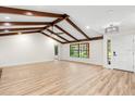 Bright living room with wood-beamed ceilings and an abundance of natural light at 643 Princewood Dr, Deland, FL 32724