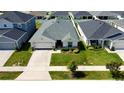 Bird's-eye view of a well-maintained home with green lawn in a friendly neighborhood at 7 Polermo Ave, St Cloud, FL 34771