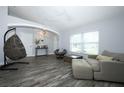 Spacious living room with lots of natural light and plenty of seating at 759 Lake Como Dr, Lake Mary, FL 32746