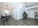 Open-concept living space featuring modern flooring, dining area, and stylish decor at 759 Lake Como Dr, Lake Mary, FL 32746