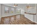 Bright living room featuring wood floors, large windows and breakfast bar for casual dining at 911 N Orange Ave # 443, Orlando, FL 32801