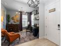 Inviting home office featuring stylish decor, modern lighting, and a comfortable leather chair at 971 Braewood Dr, Clermont, FL 34715