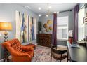Charming home office features modern lighting, artwork, and a comfortable leather chair at 971 Braewood Dr, Clermont, FL 34715