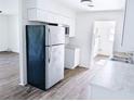 Well-lit kitchen featuring updated appliances, white cabinets, and sleek countertops providing ample workspace at 1200 Ne 45Th Pl, Ocala, FL 34479