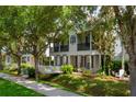 Attractive two-story home with a black balcony and a manicured lawn, creating a welcoming curb appeal at 1615 Wilson Ave, Orlando, FL 32804