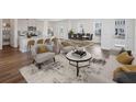 Inviting living room with stylish furnishings, open to kitchen and dining area at 1878 Seawall Way, Celebration, FL 34747