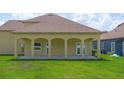 Covered patio featuring classic archways, providing a relaxing outdoor living space at 1919 Sipes Ave, Sanford, FL 32771