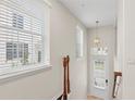 Bright entryway featuring natural light, neutral paint, and a stylish pendant light fixture at 2058 Prospect Ave, Orlando, FL 32814