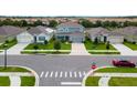 A bird's-eye view of a neighborhood with well-manicured lawns and neatly arranged houses at 2355 White Lilly Dr, Kissimmee, FL 34747