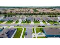 A high angle view of an organized residential community with similar styled homes at 2355 White Lilly Dr, Kissimmee, FL 34747