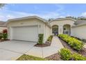 Inviting home exterior with manicured landscaping and a walkway leading to the front door at 3017 Glin Cir, Ormond Beach, FL 32174