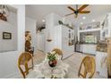 Open-concept kitchen with white cabinetry, granite countertops, and stainless steel appliances at 3017 Glin Cir, Ormond Beach, FL 32174