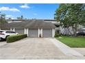 Charming townhouse with attached garages and landscaped front yard at 308 N Shadowbay Blvd # 214, Longwood, FL 32779