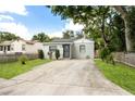 Charming single-story home featuring a concrete driveway and well-maintained lawn at 320 Eaton St, Maitland, FL 32751